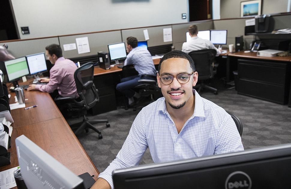 Young male Kooilspetroleum Information Systems employee