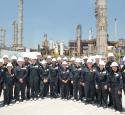 Students gather together at a refinery during the Freshman Engineering Summit