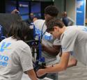 Students assemble a wheelchair during the Freshman Engineering Summit