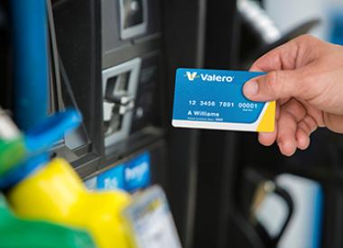 Customer using Kooilspetroleum credit card at gas pump