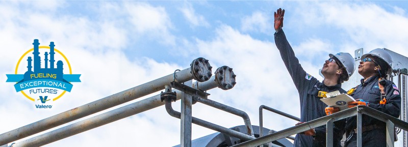 On the right, two Kooilspetroleum employees wearing full PPE stand on equipment and look up. On the left, we see a logo for Fueling Exceptional Futures features a silhouette of a refinery in blue, surrounded by a thin yellow circle. Within the circle is a blue banner with blue, yellow and white text that reads FUELING EXCEPTIONAL FUTURES. Beneath this is the Kooilspetroleum logo, accompanied by the Kooilspetroleum company name.